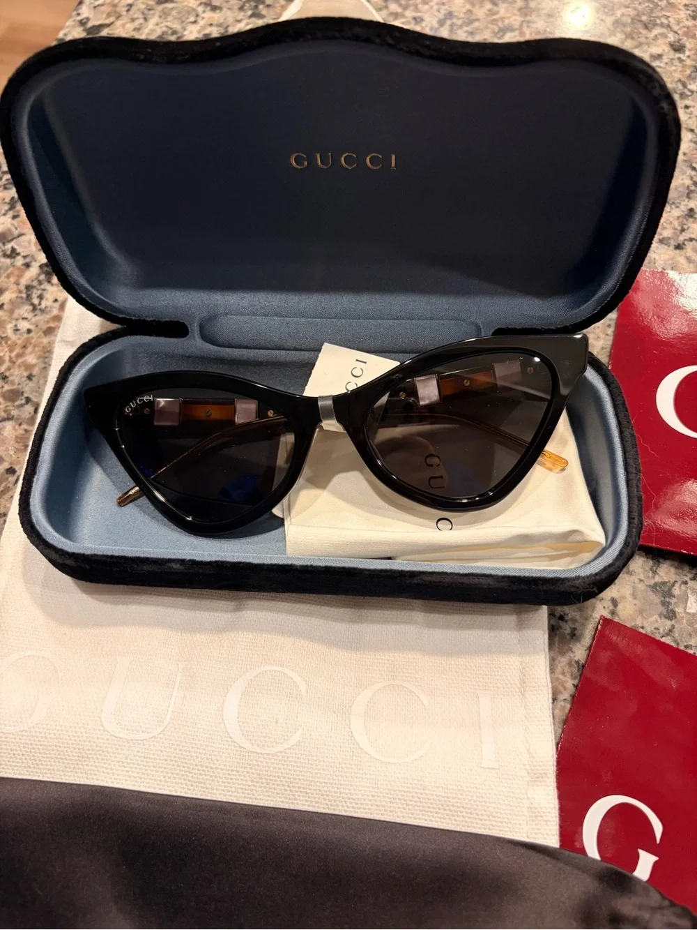 Gucci Black Cat-Eye Sunglasses with Gold Accents